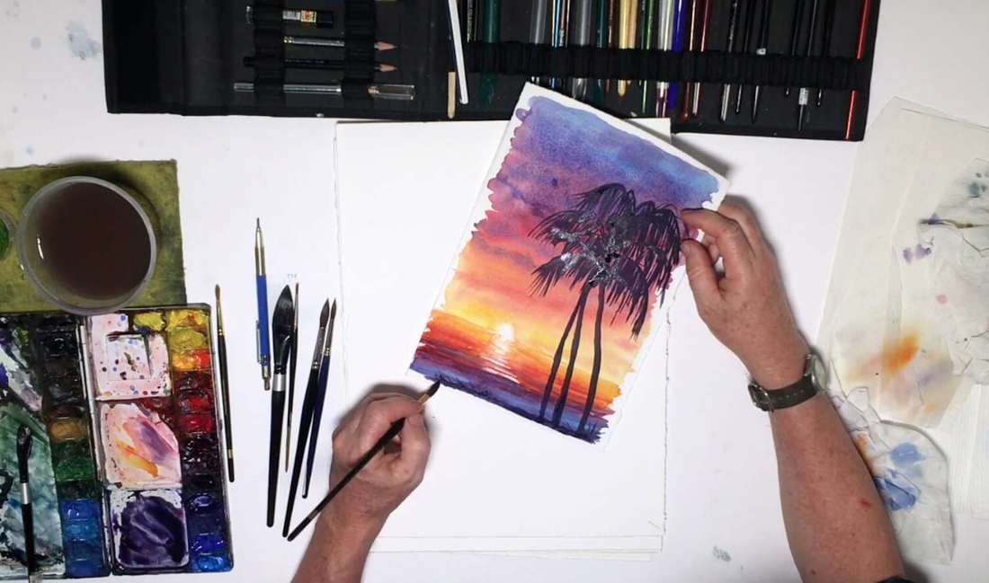 Мужчина рисует пейзаж